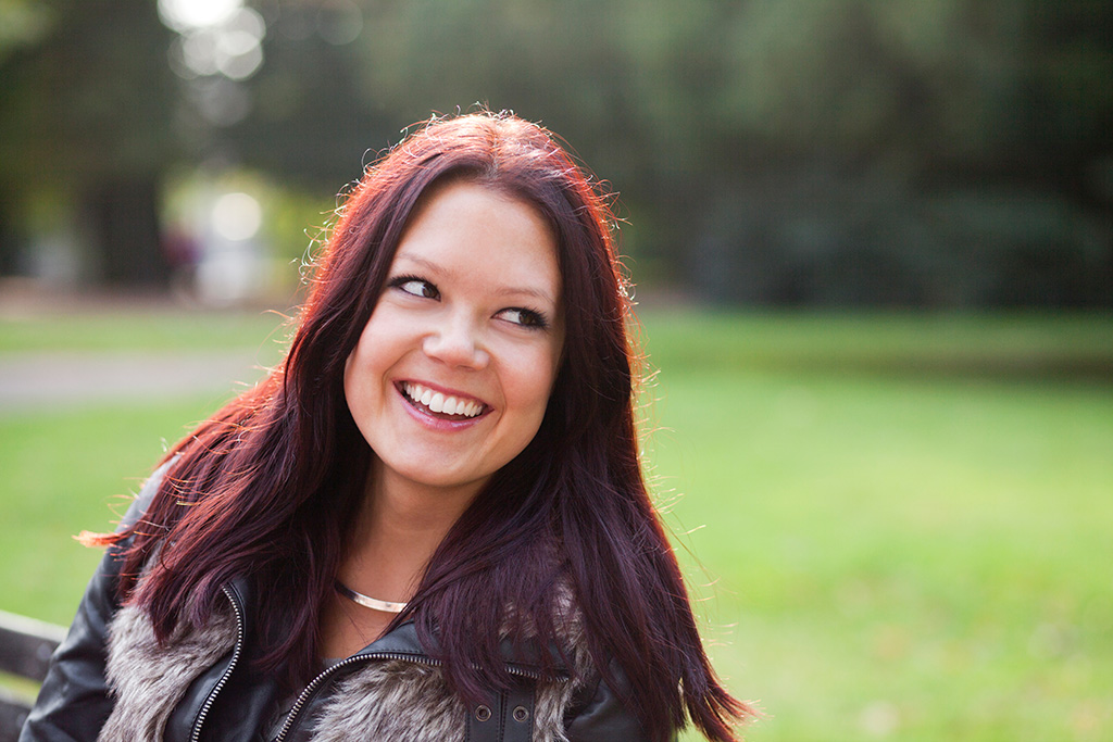 woman smiling in park